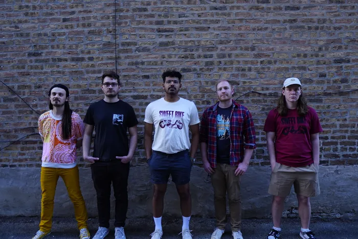 tenmonthsummer, the full band standing in a graffiti-lined Chicago alley