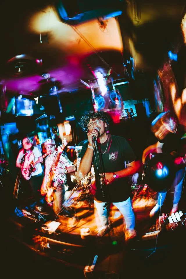 Nish (center) at Emo Nite