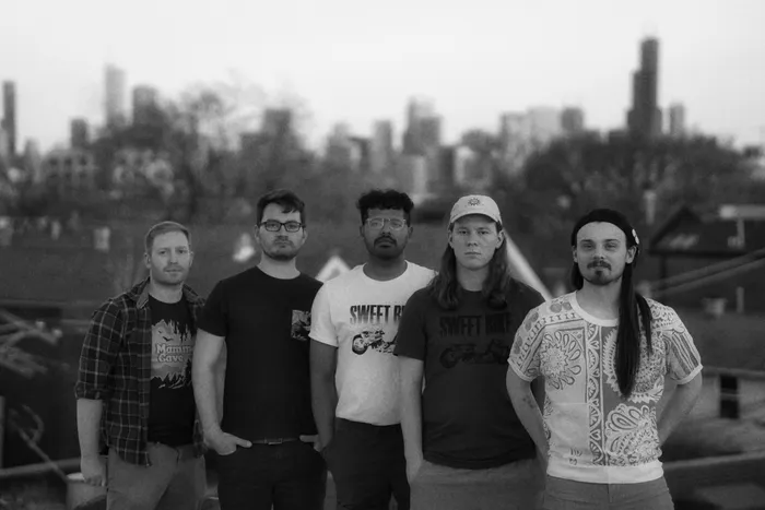 tenmonthsummer, the full band posed on a Chicago rooftop at dusk, black and white